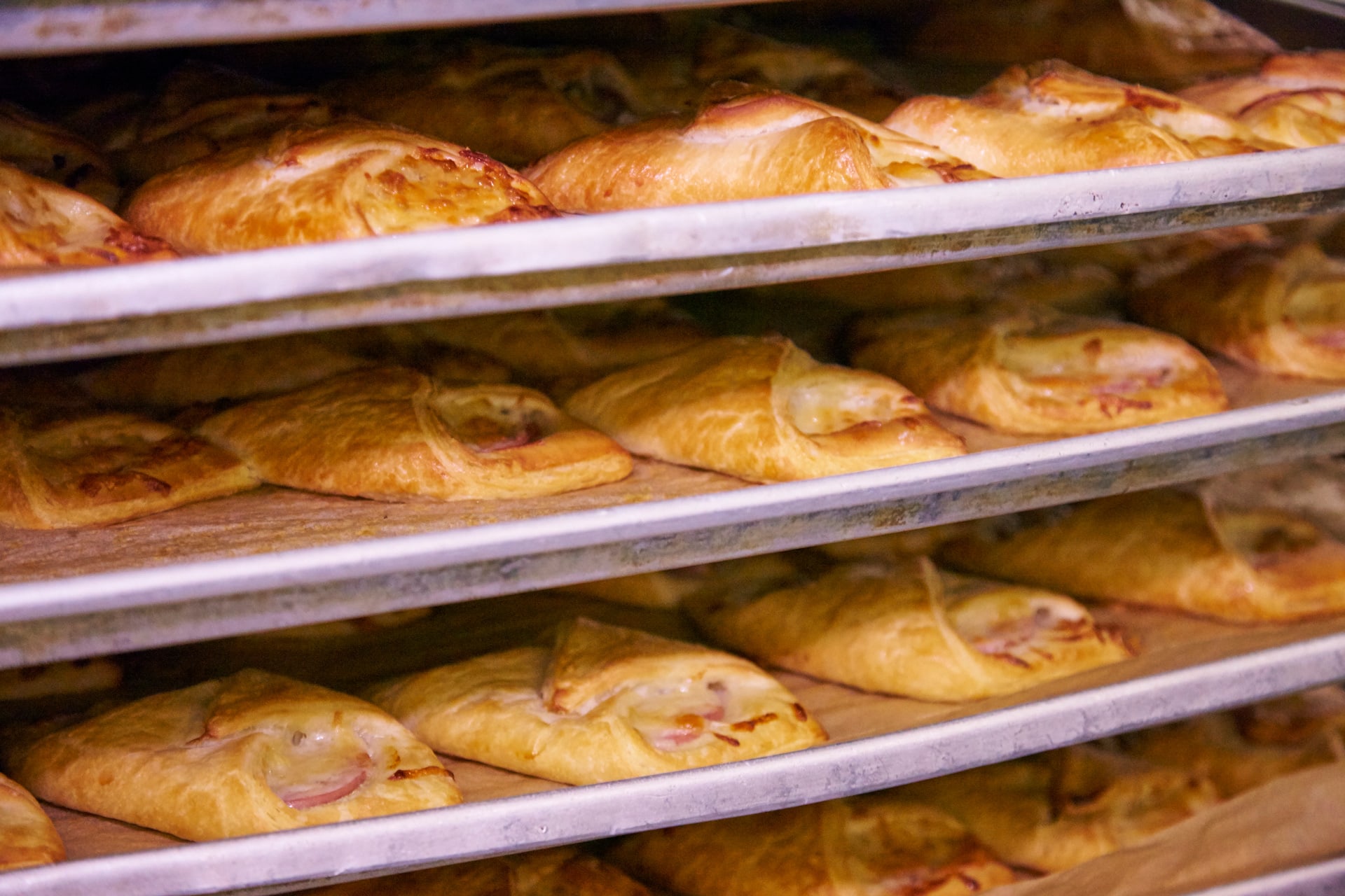 ham and cheese croissants cool on trays