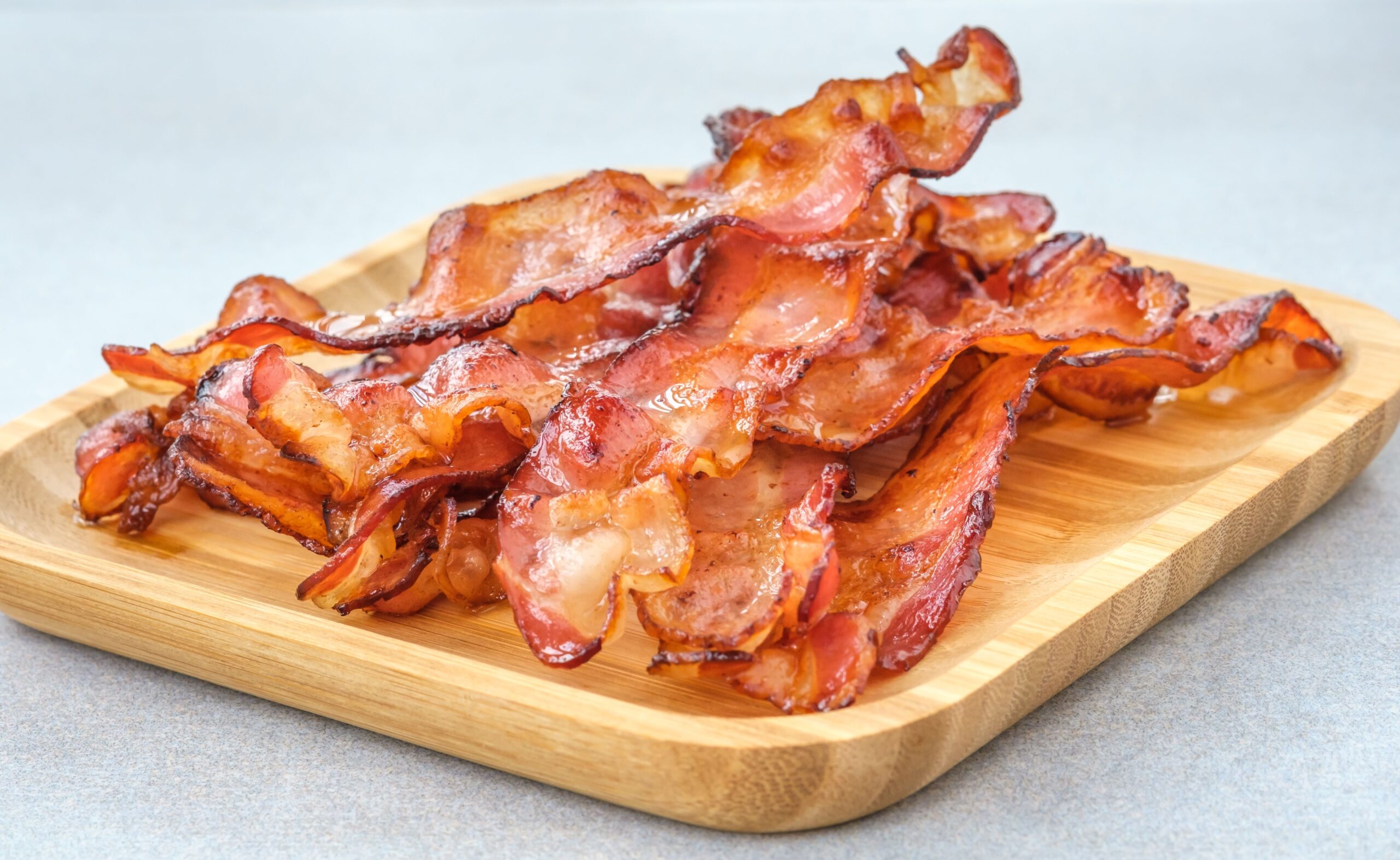 bacon sizzling in skillet
